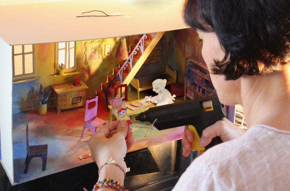 Antje Damm while building a three-dimensional scenery for her book 