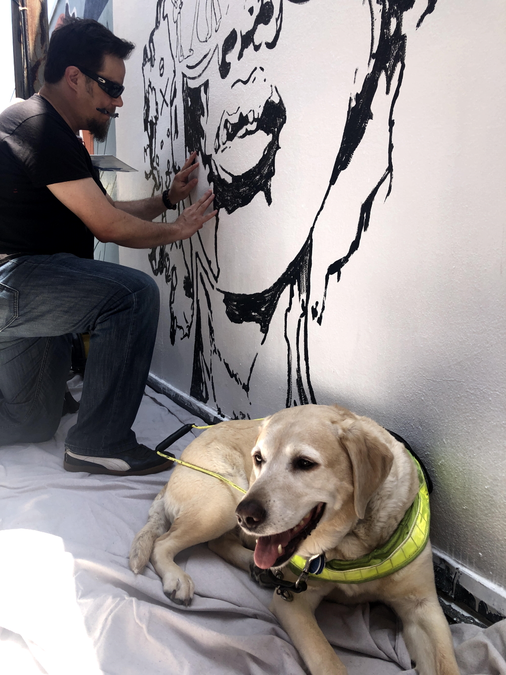 John Bramblitt working on a mural painting