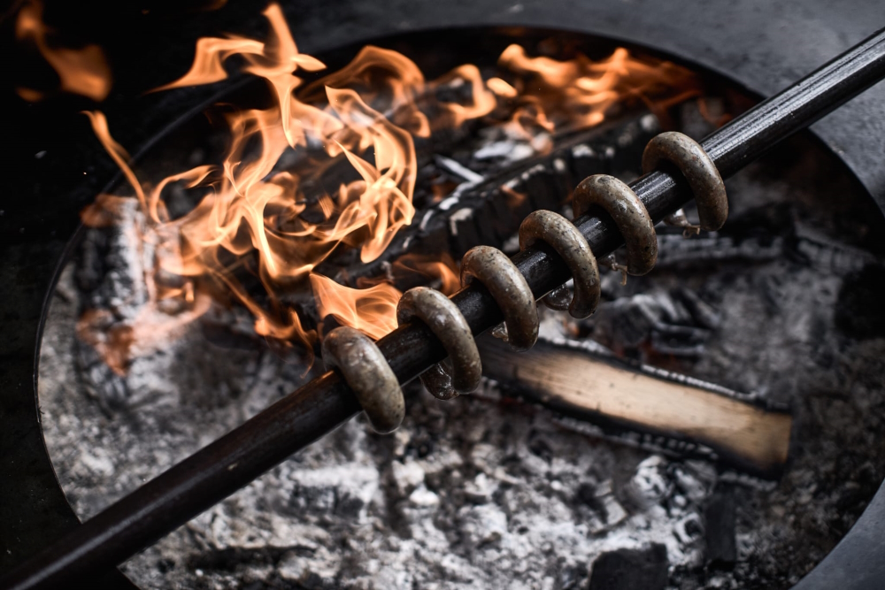 The famous 'Wiesner's sausages' roasting above the 'ring of fire'.