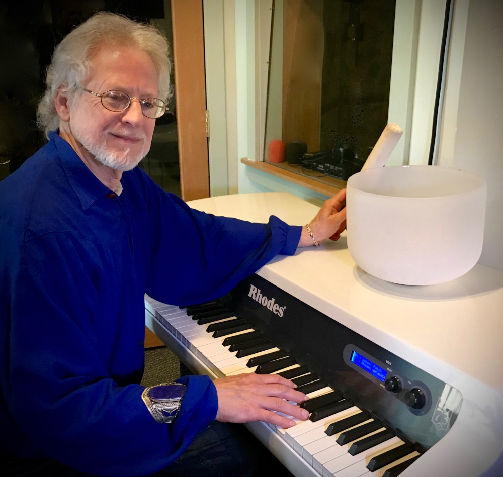 Steven Halpern at the Fender Rhodes and a crystal bowl in front of him.