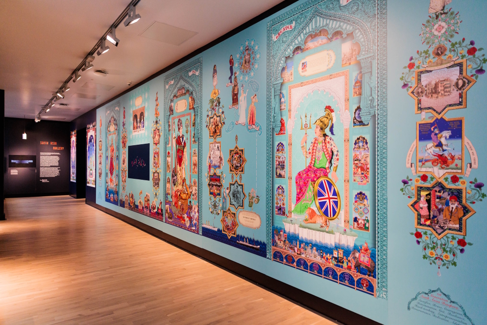 'Riches to Rags, Rags to Riches' (in situ shot), South Asia Gallery 17 meter long mural, 2023. Commissioned by Manchester Museum, part of the University of Manchester.